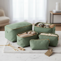Luxury packing cube set in sage green with gold zippers